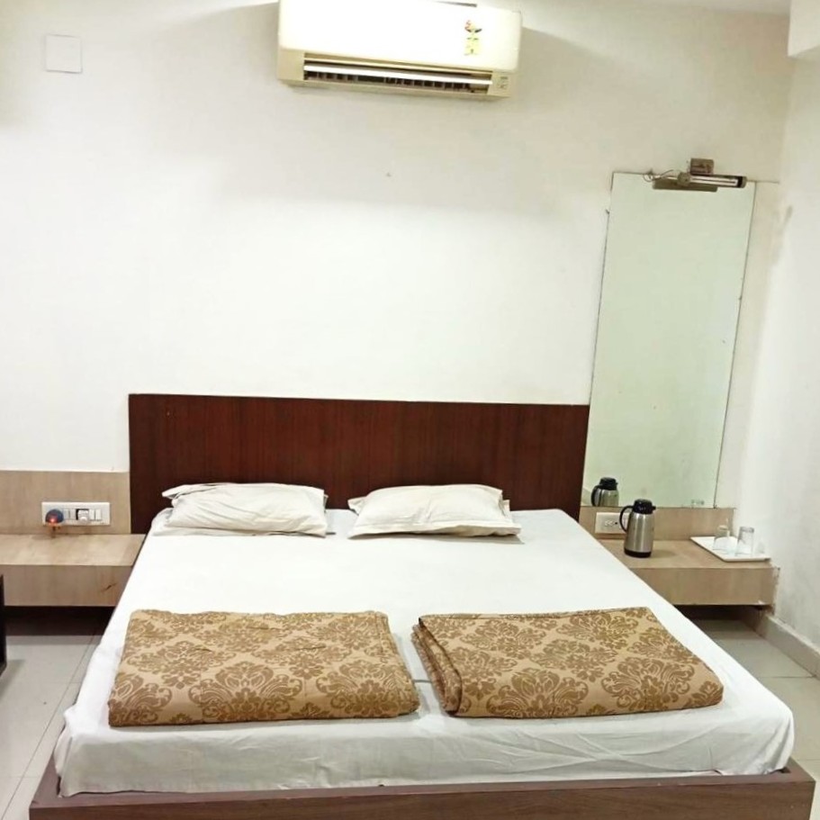 Spacious double bed AC room at Shree Paras White Hotel, Amreli Gujarat