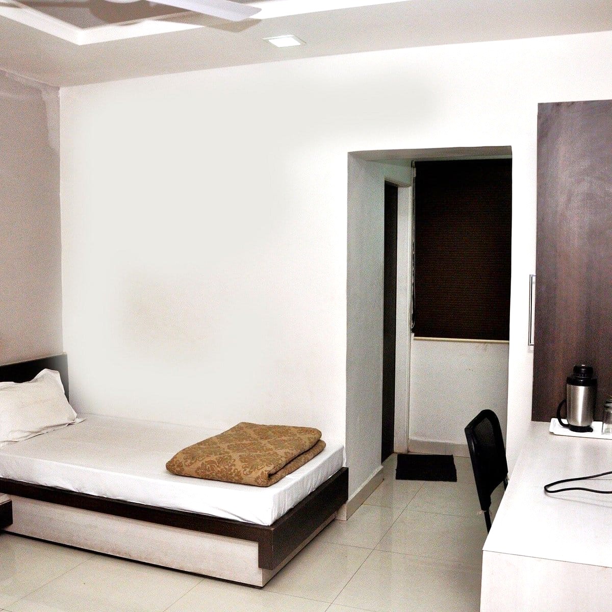Spacious double bed AC room at Shree Paras White Hotel Amreli